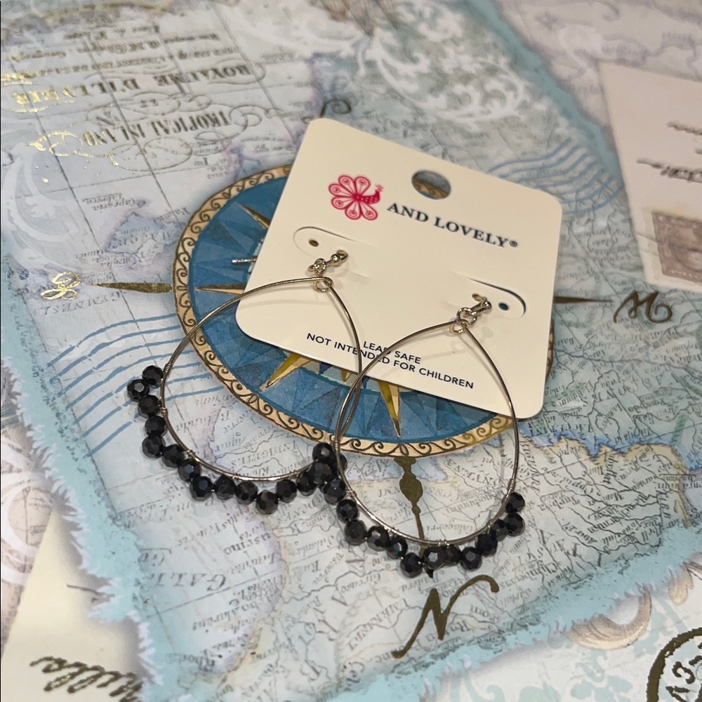 And Lovely teardrop hoop earrings with black beads